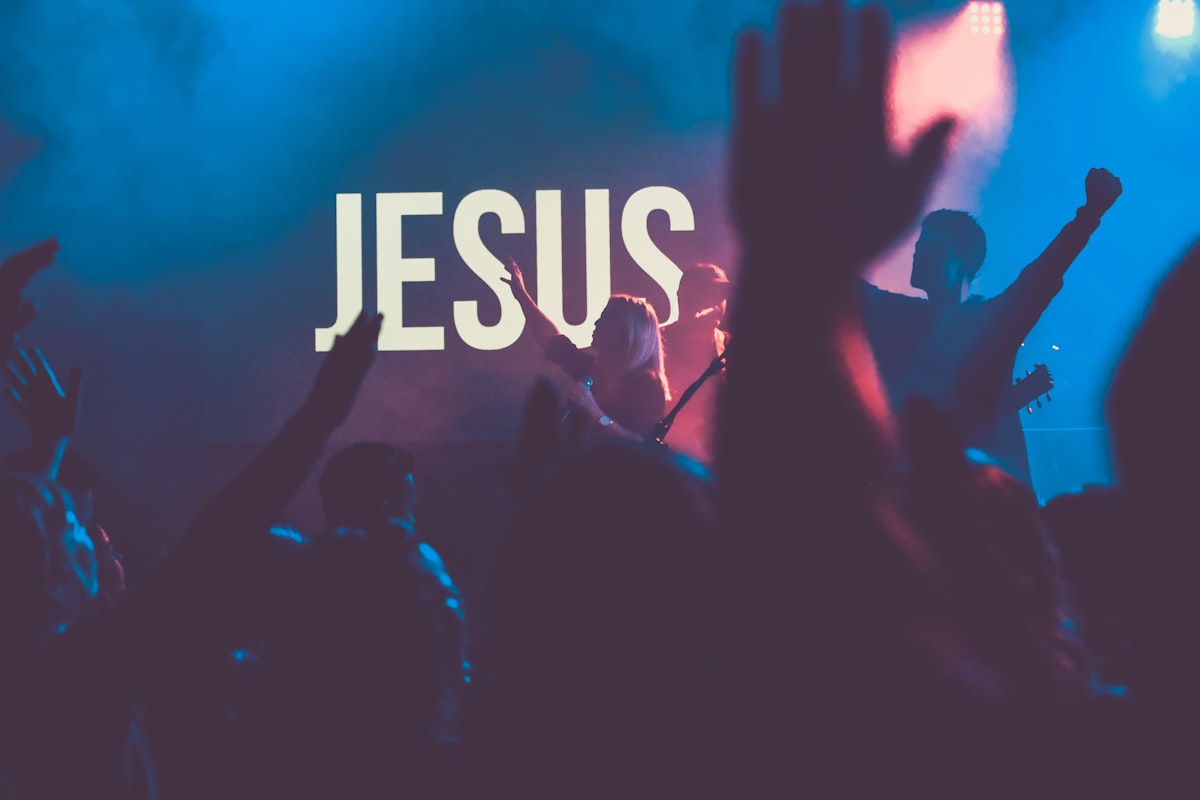 A congregation worshipping with raised hands